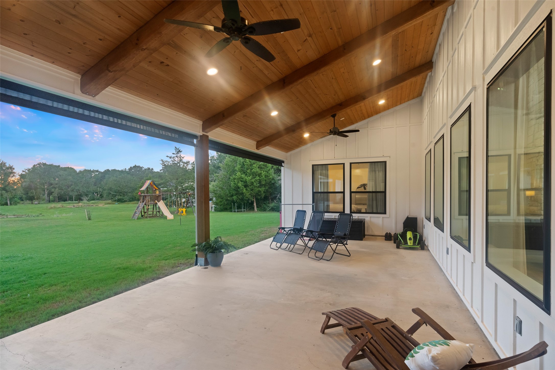 27201 Double Culvert Road Hempstead, TX 77445 - Photo 41 of 49 Covered back patio offers ample lounging space with ceiling fans, recessed lighting, and shades for year-round comfort.