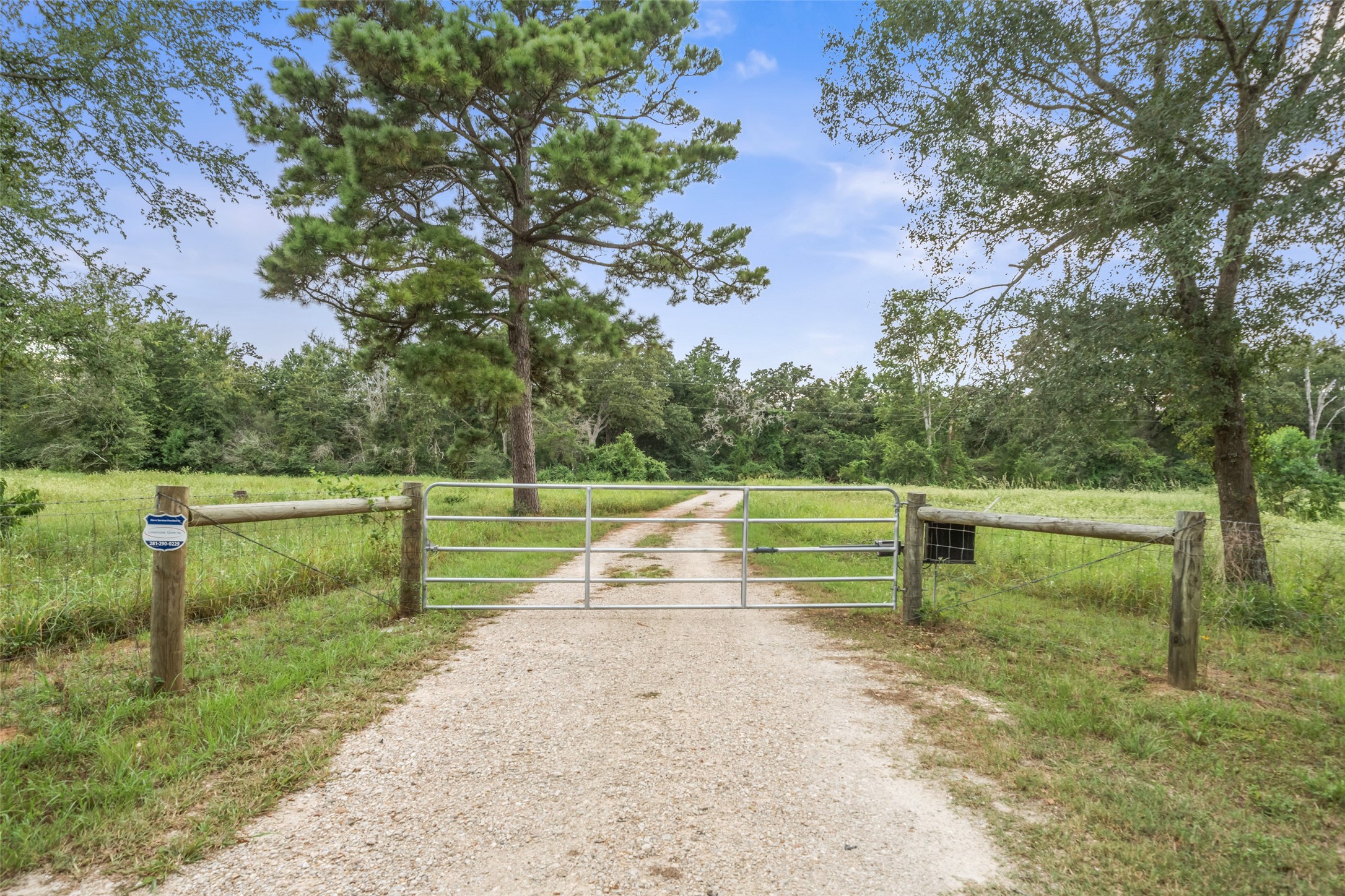 27201 Double Culvert Road Hempstead, TX 77445 - Photo 42 of 49 A gated entry and gravel drive set the tone for privacy and convenience as you approach the property.