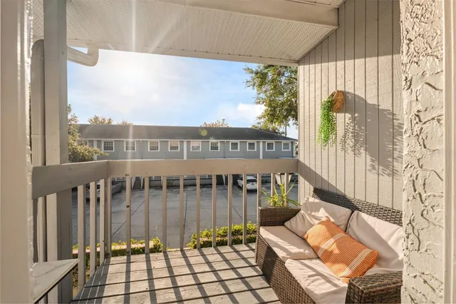 a view of a balcony with wooden floor