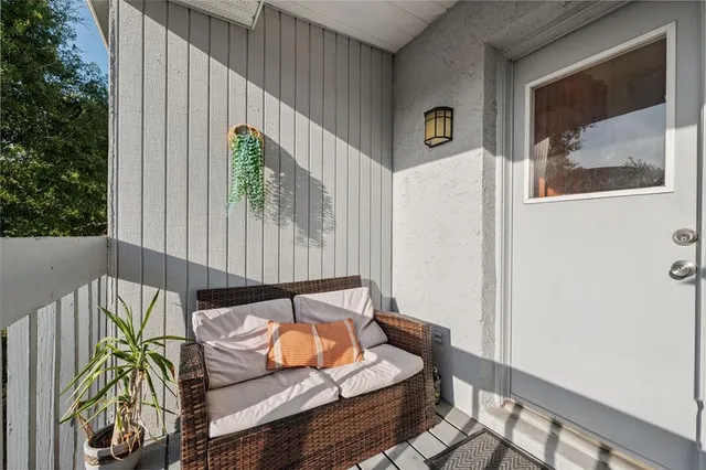 a view of balcony with furniture