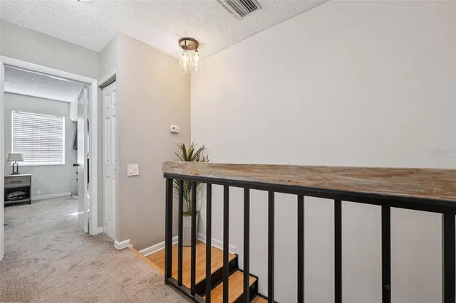 a view of a hallway with seating area