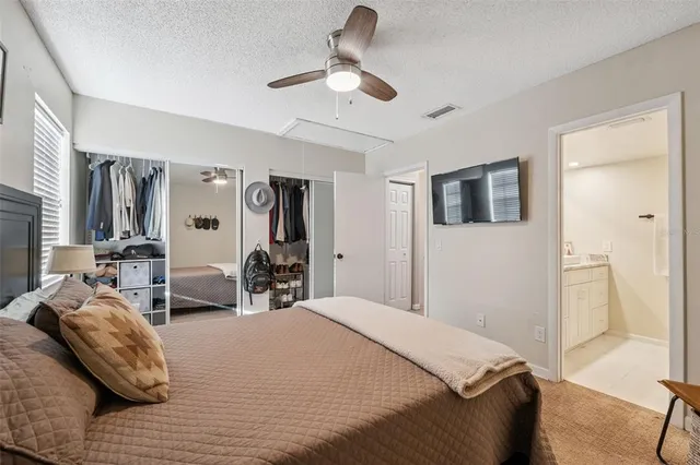 a bedroom with bed and window