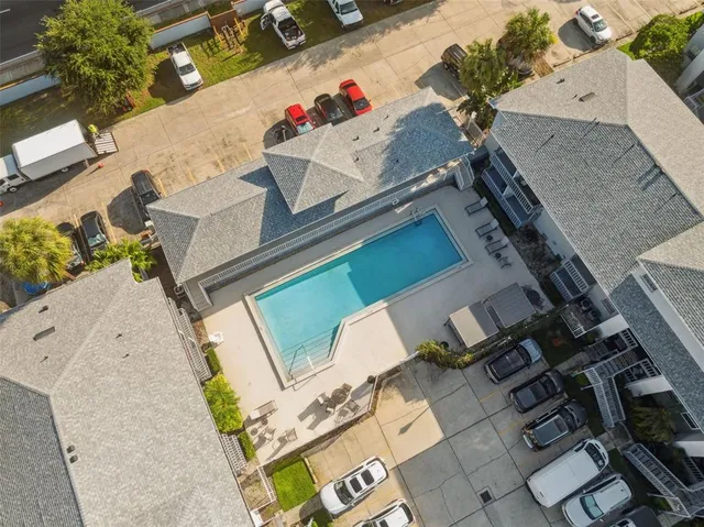 an aerial view of a house with a swimming pool