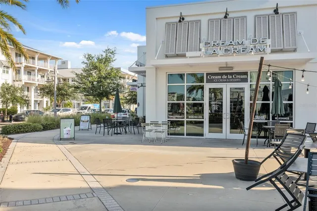 a building exterior with furniture and outdoor space