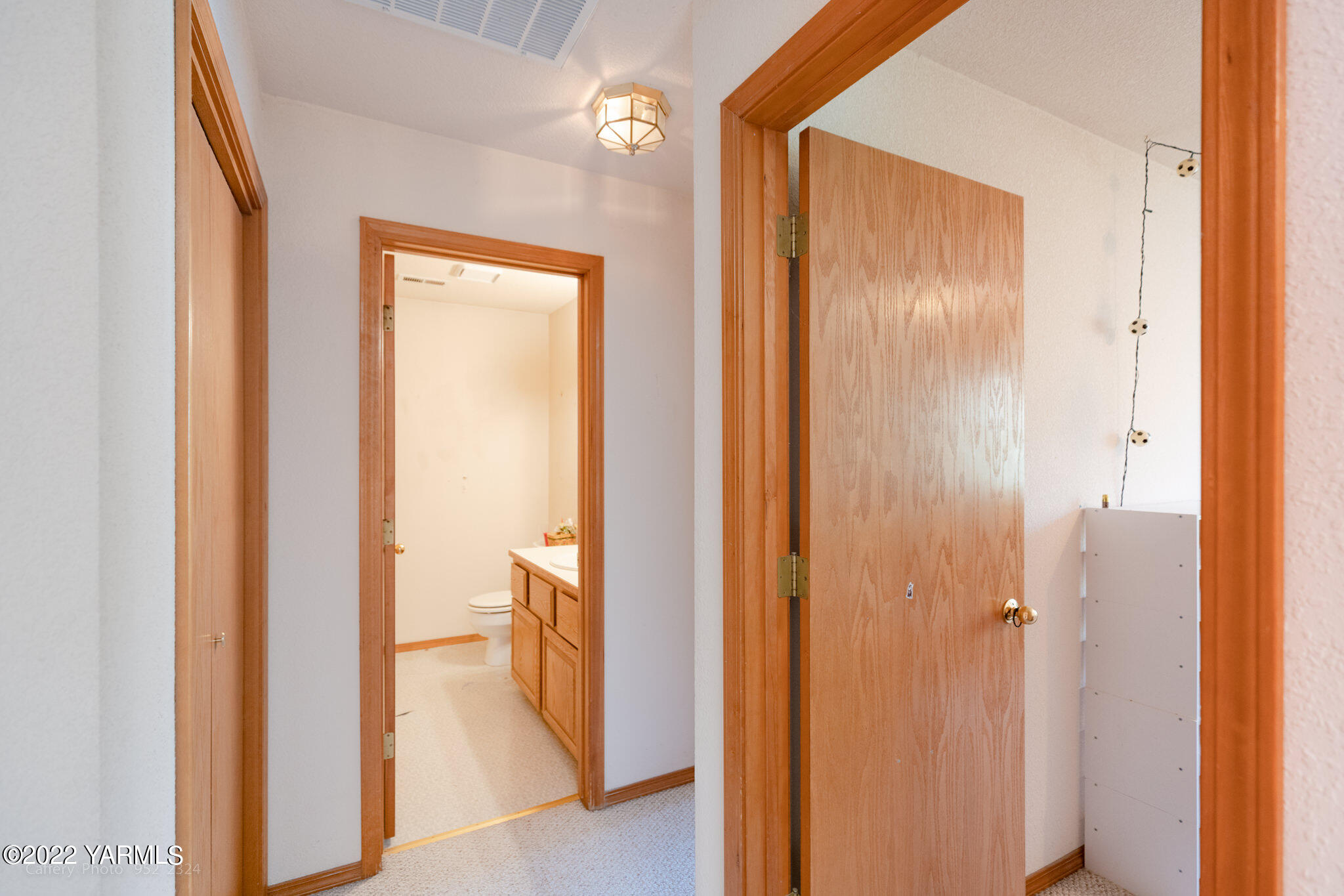3870 Aaron Road Moxee, WA 98936 - Photo 16 of 33 a view of a bathroom from a hallway
