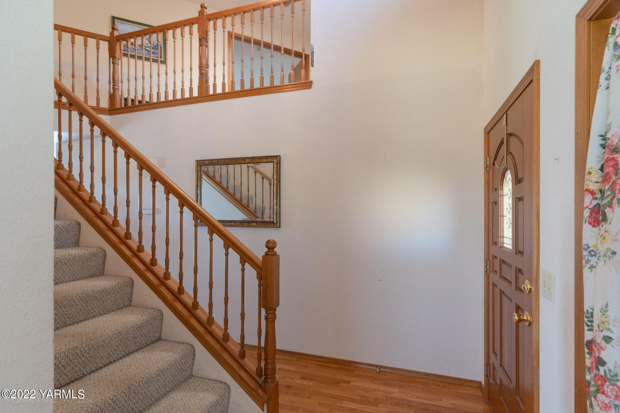 3870 Aaron Road Moxee, WA 98936 - Photo 3 of 33 a view of staircase with wooden floor and white walls