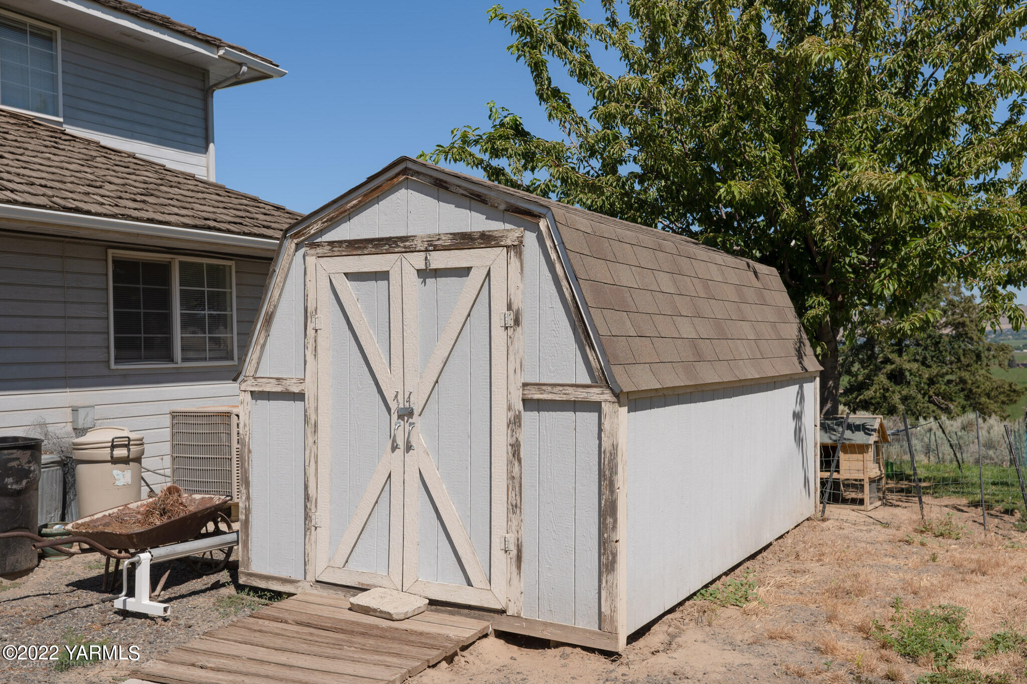 3870 Aaron Road Moxee, WA 98936 - Photo 31 of 33 a small white house with a white roof and stairs