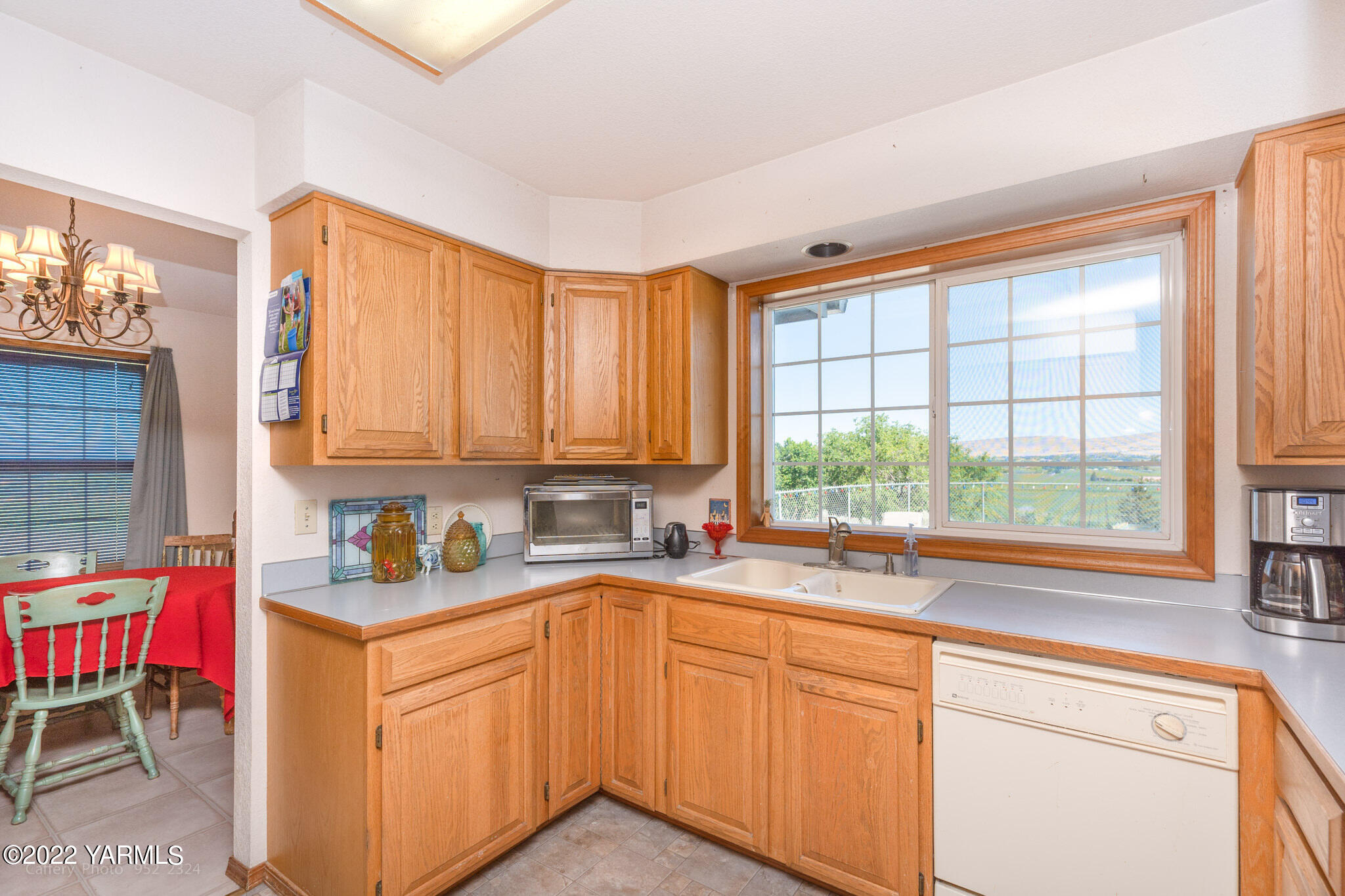 3870 Aaron Road Moxee, WA 98936 - Photo 8 of 33 a kitchen with a sink stove and cabinets