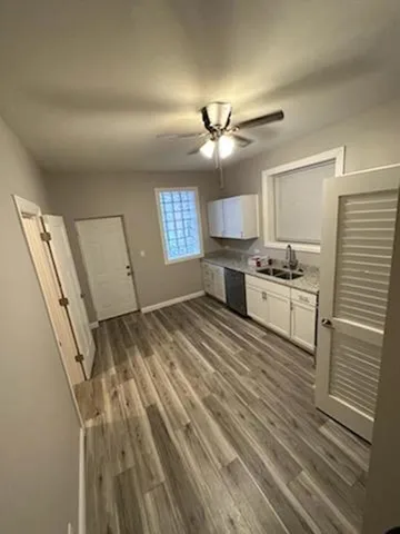 a view of kitchen with sink microwave and refrigerator