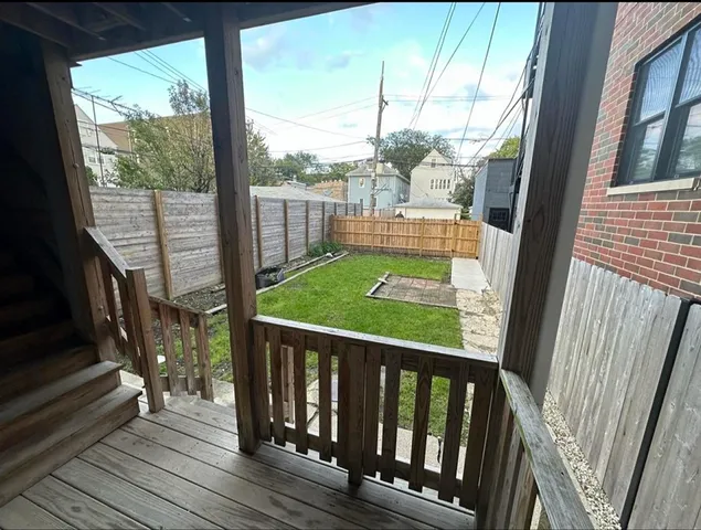 a view of balcony with wooden floor