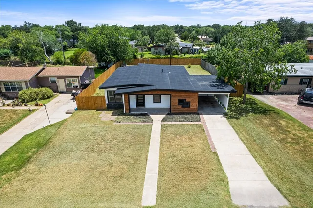 a aerial view of a house with swimming pool