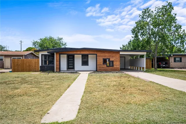 front view of a house with a yard