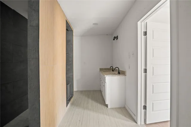 a view of a storage & utility room with a sink