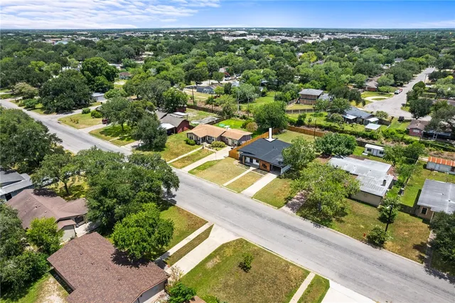 an aerial view of residential houses with outdoor space