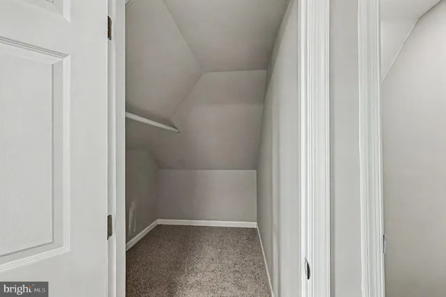a view of hallway with closet