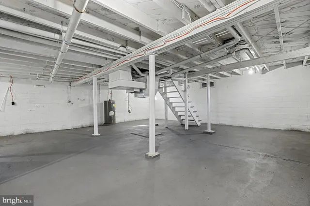 a view of a room with wooden ceiling