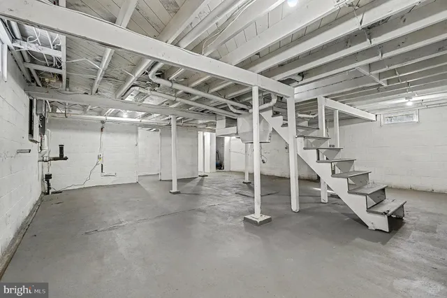 a view of an empty room with stairs