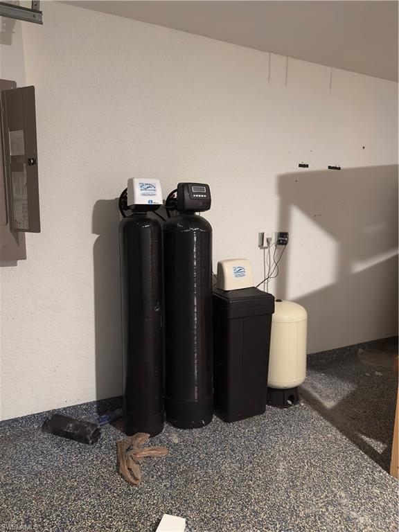 3707 38th Street Southwest Lehigh Acres, FL 33976 - Photo 16 of 16 Detailed view of a water softener system and electric panel