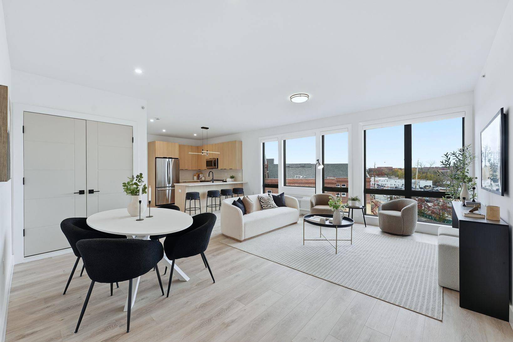 9-11 Passaic Street, Unit 302 Hackensack, NJ 07601 - Photo 3 of 13 a living room with furniture and a large window