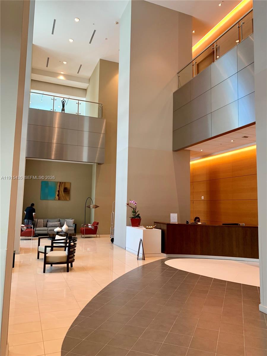 300 South Biscayne Boulevard, Unit T1509 Miami, FL 33131 - Photo 15 of 27 a lobby with furniture and a floor to ceiling window