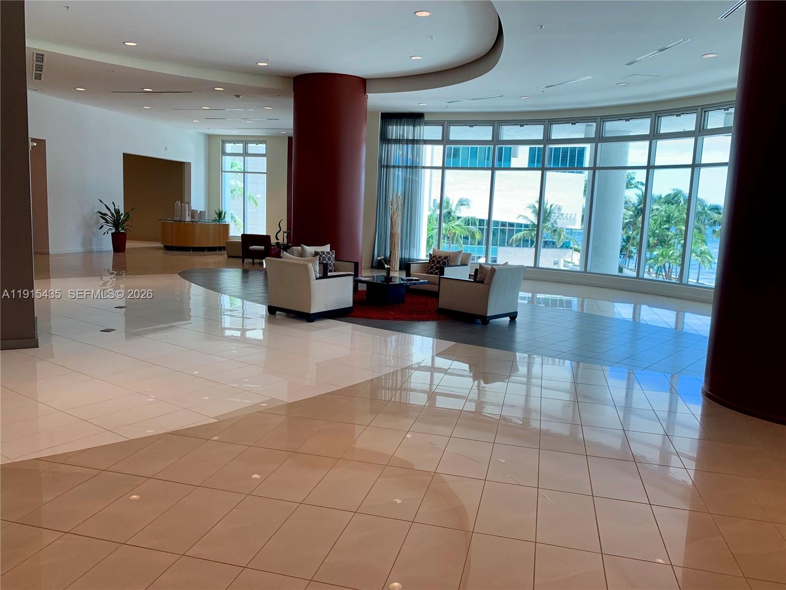 300 South Biscayne Boulevard, Unit T1509 Miami, FL 33131 - Photo 22 of 27 a lobby with furniture and floor to ceiling window