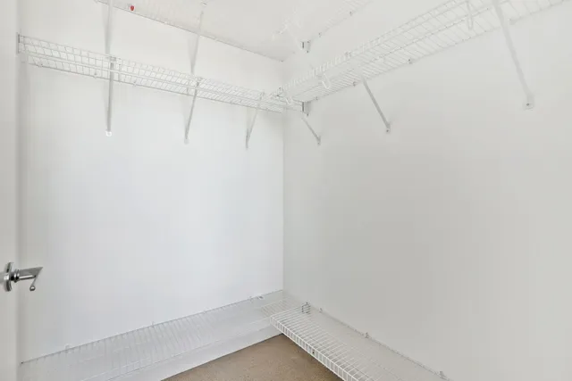 a view of a room with racks on the wall