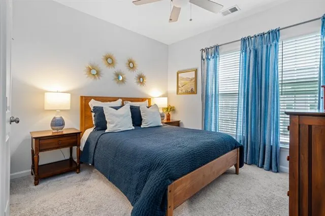 a bedroom with a bed and flat screen tv