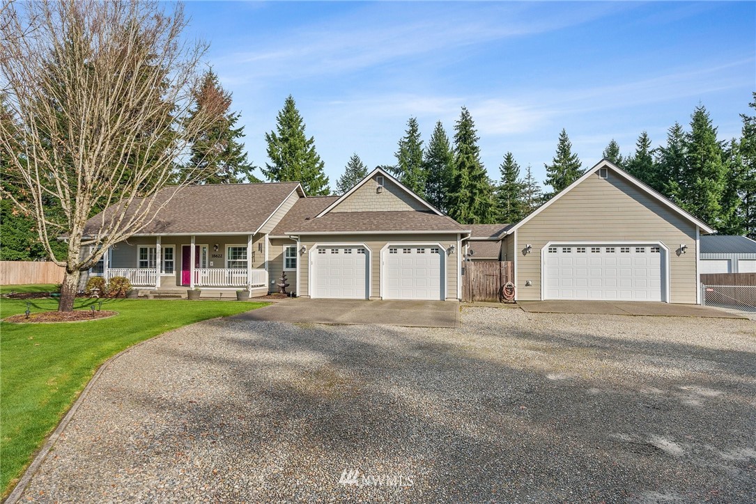 18622 Melon Street Southwest Rochester, WA 98579 - Photo 1 of 33 a front view of a house with yard and green space