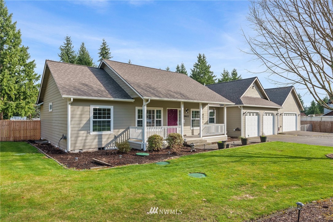 18622 Melon Street Southwest Rochester, WA 98579 - Photo 2 of 33 a front view of house with yard outdoor seating and green space