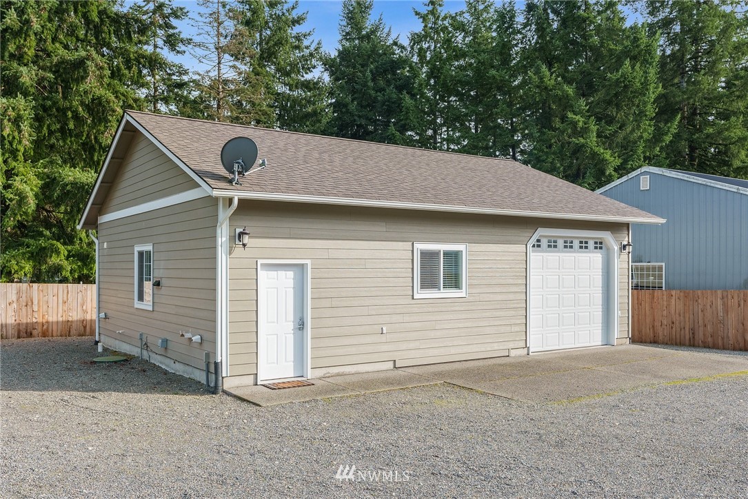18622 Melon Street Southwest Rochester, WA 98579 - Photo 29 of 33 a front view of a house with yard and garage
