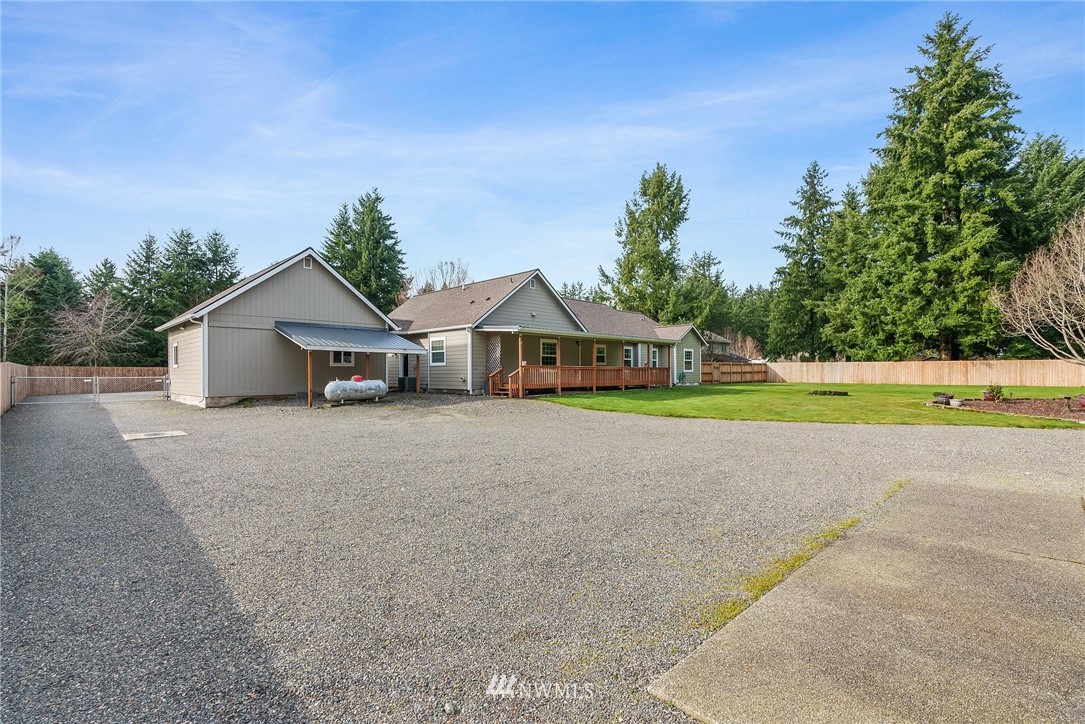 18622 Melon Street Southwest Rochester, WA 98579 - Photo 30 of 33 a house with swimming pool in front of it