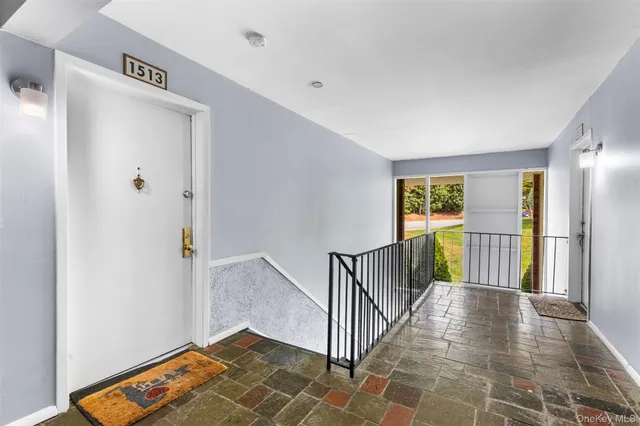 a bathroom with a sink and a refrigerator
