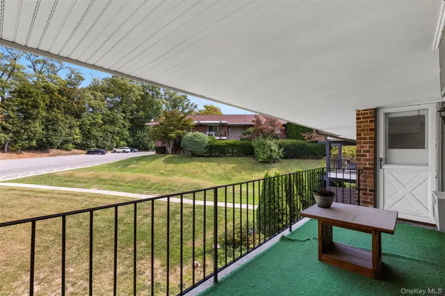 a view of a porch with a yard