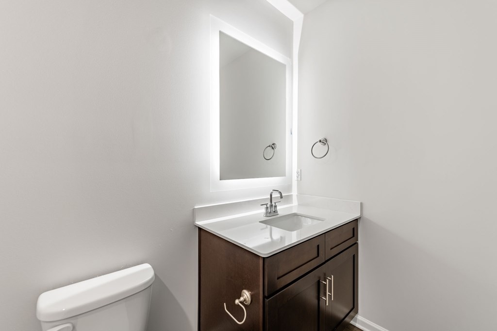 50 Grove Loop Blue Ridge, GA 30513 - Photo 22 of 27 a bathroom with a toilet sink and mirror
