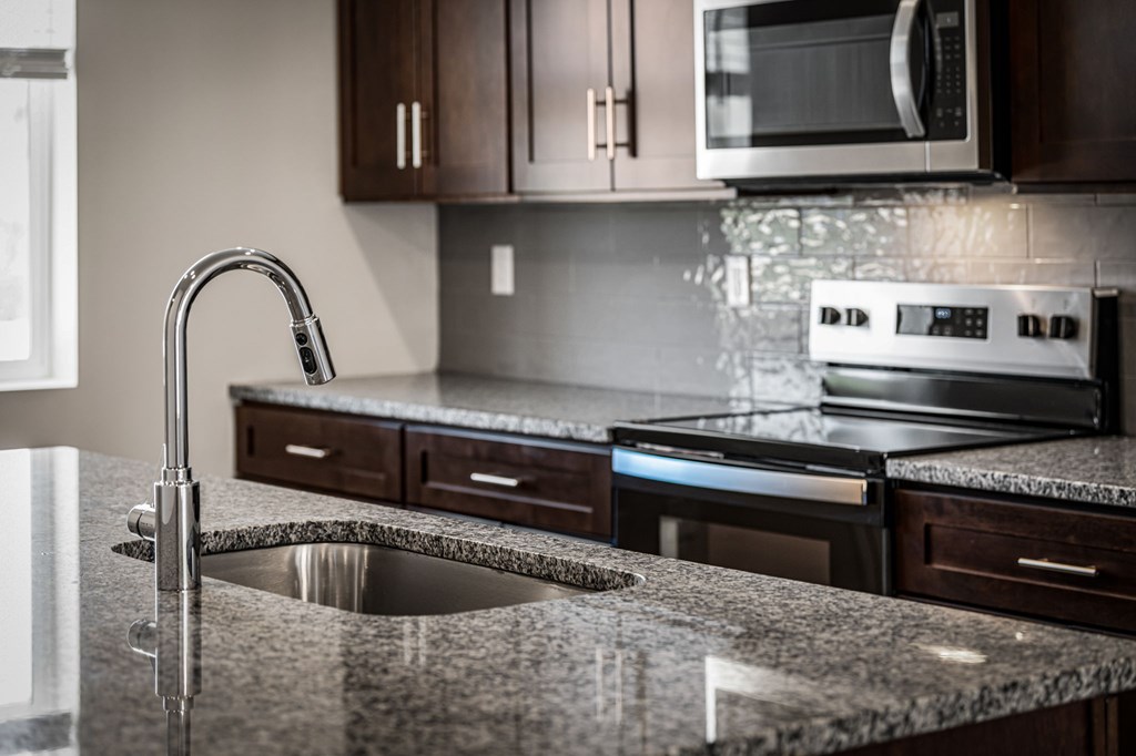 50 Grove Loop Blue Ridge, GA 30513 - Photo 24 of 27 a kitchen with granite countertop a stove and a sink