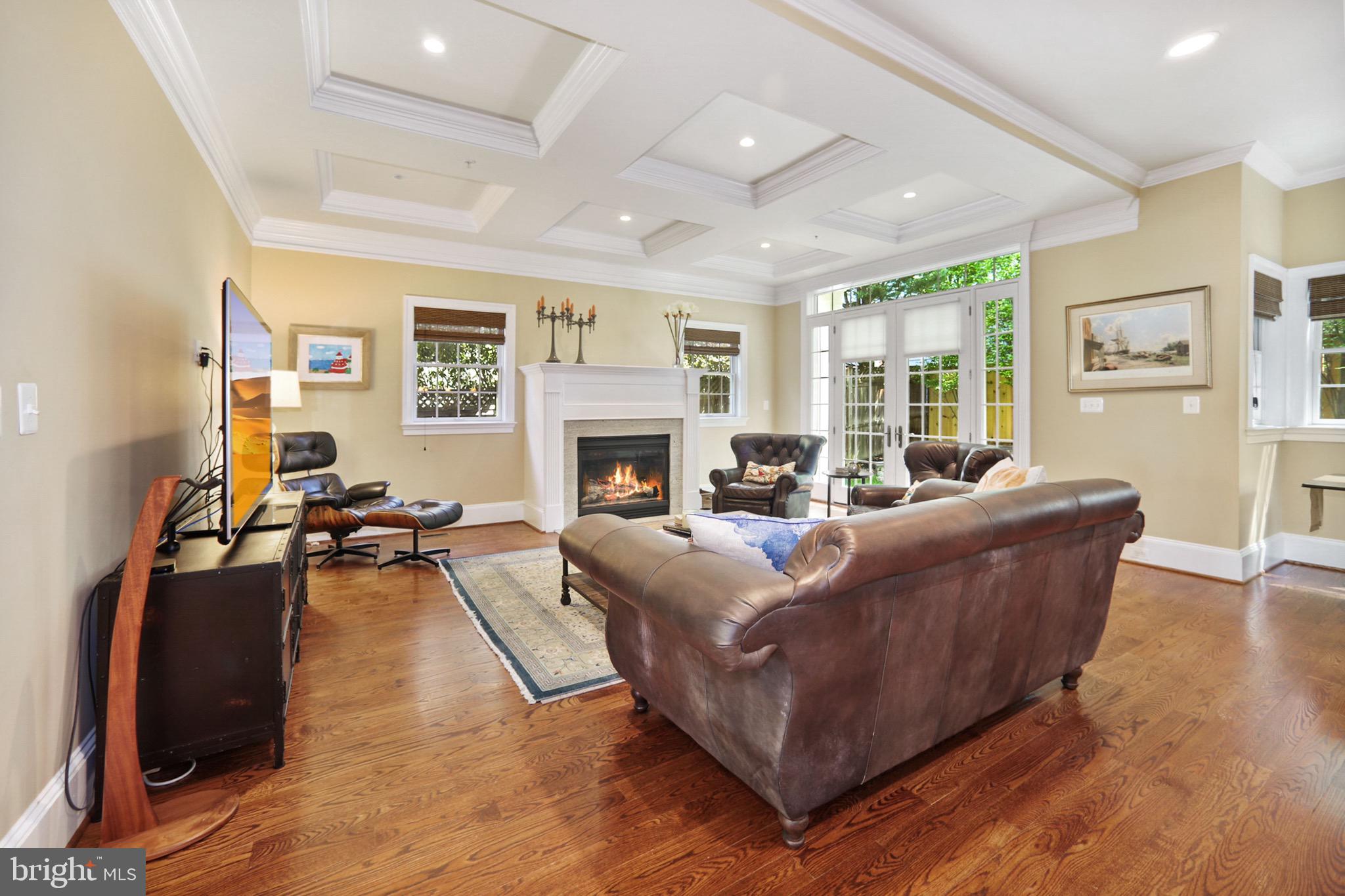 7117 Exfair Road Bethesda, MD 20814 - Photo 11 of 42 a living room with furniture and a fireplace