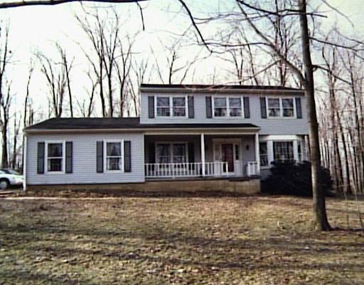 283 Ridge Road New Milford, CT 06776 - Photo 1 of 1 a front view of a house with yard and trees