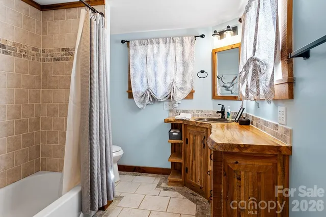 a bathroom with a sink a mirror and a bathtub