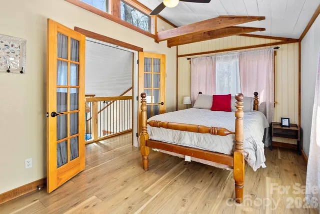 a view of a chair and table on the wooden deck
