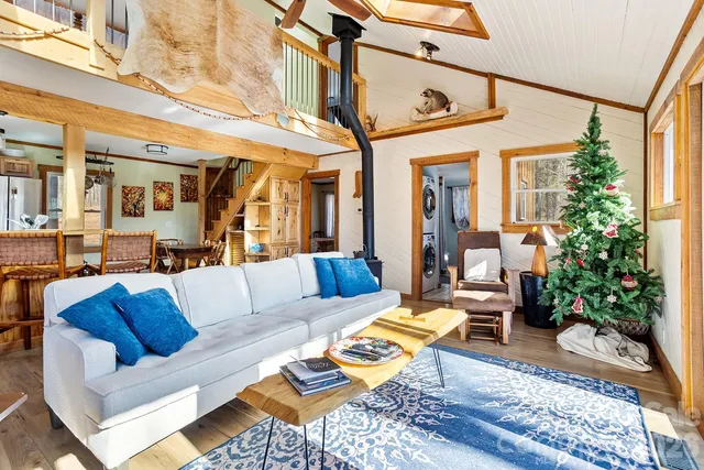 a view of a patio with couches table and chairs and potted plants