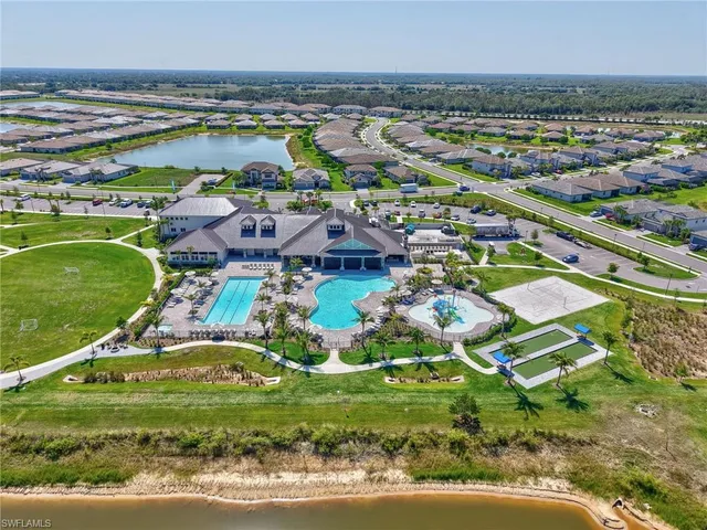 view of a tennis ground with large trees