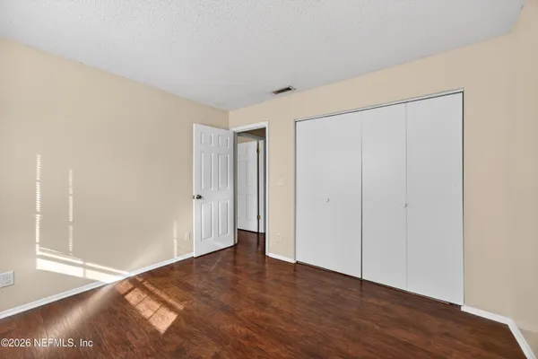 a view of livingroom with wooden floor