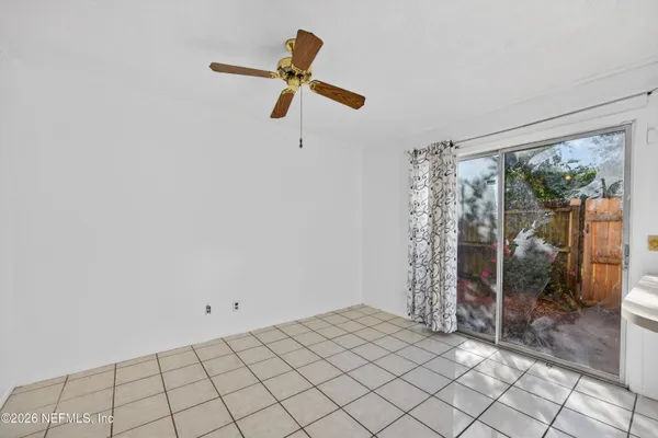 a view of a livingroom with a flesh screen tv