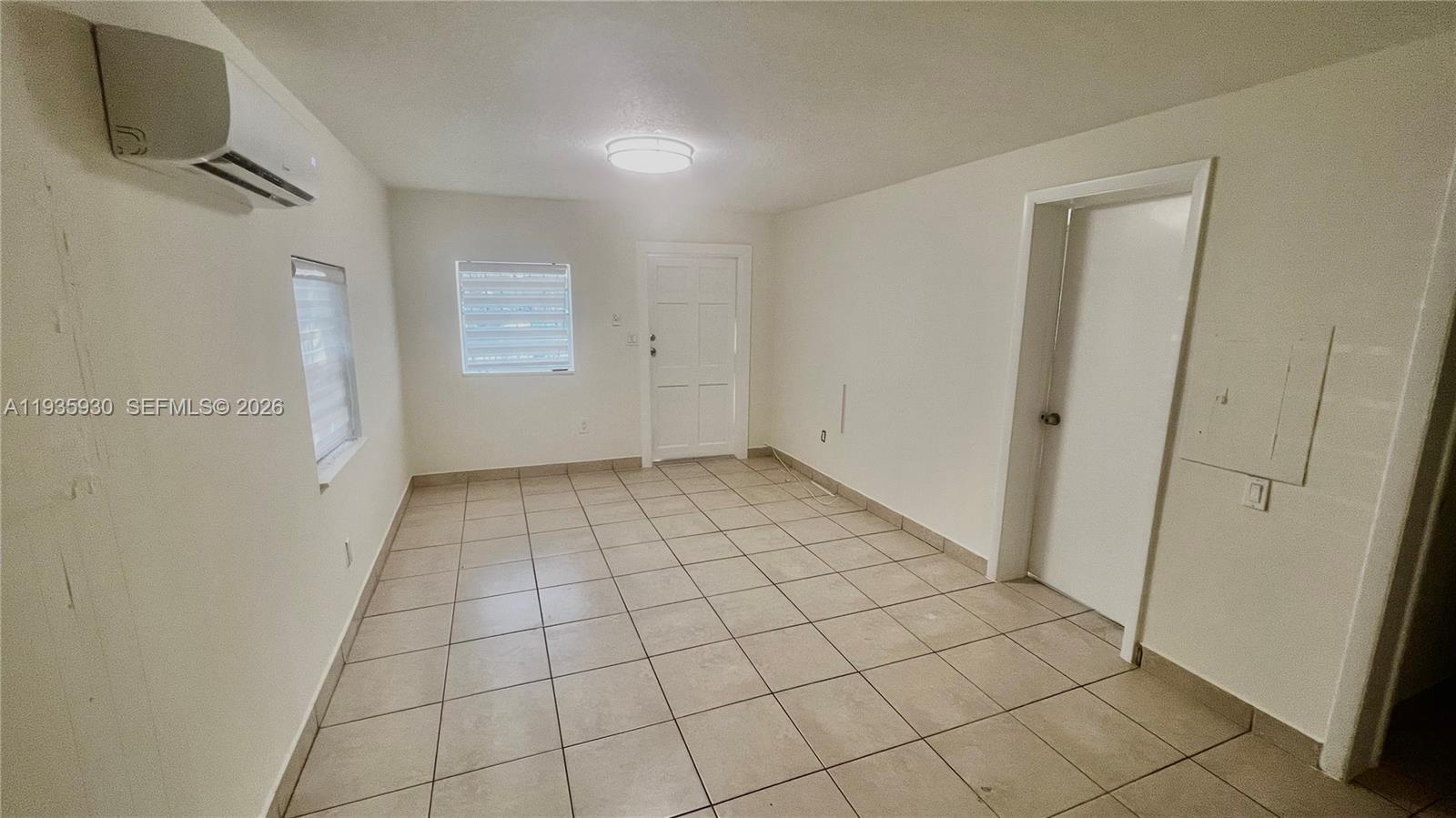 3560 Southwest 25th Terrace Miami, FL 33133 - Photo 11 of 12 a view of an empty room and window