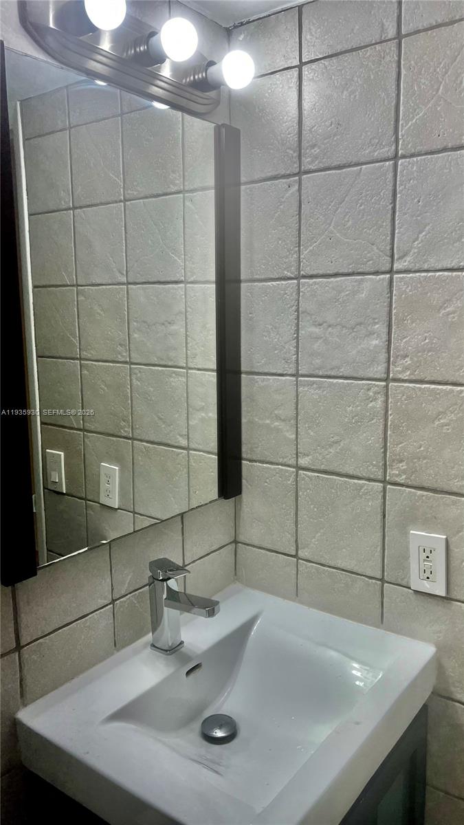 3560 Southwest 25th Terrace Miami, FL 33133 - Photo 12 of 12 a bathroom with a sink