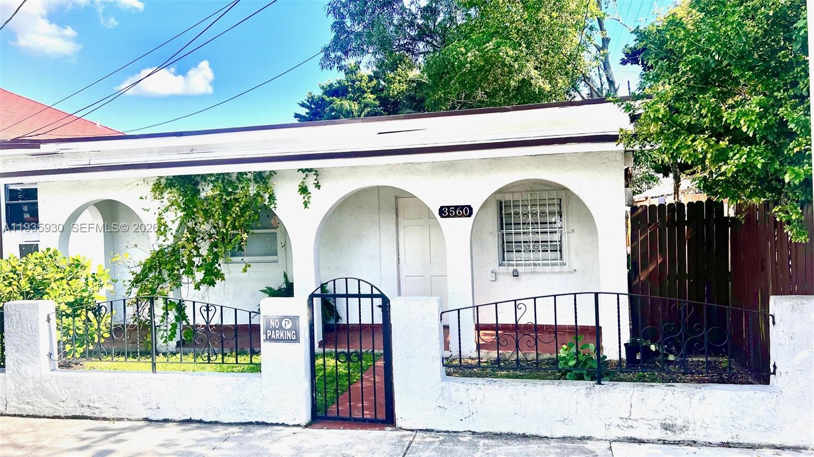 3560 Southwest 25th Terrace Miami, FL 33133 - Photo 2 of 12 a front view of a house with garden