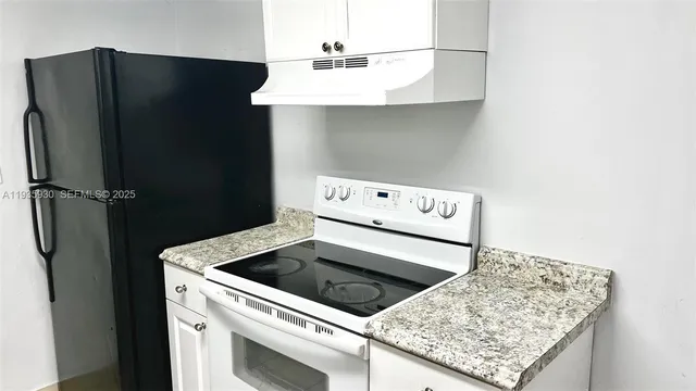 a view of a utility room with washer and dryer
