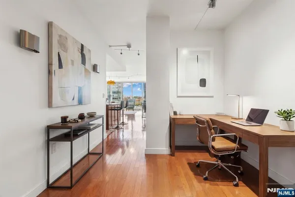 a workspace with furniture and wooden floor