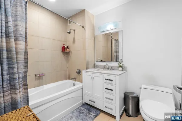 a terrace with outdoor seating and city view