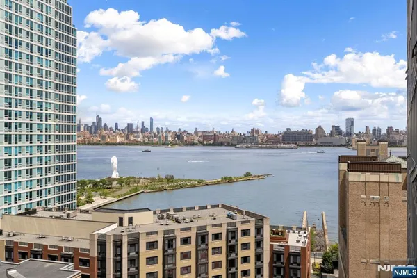 a view of a lake with building in front of it